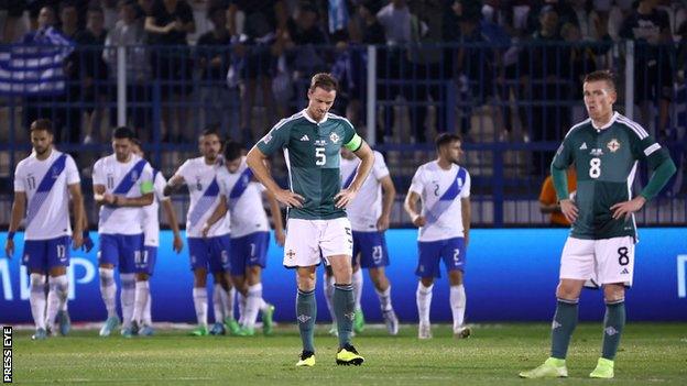 Steven Davis and Jonny Evans after a goal