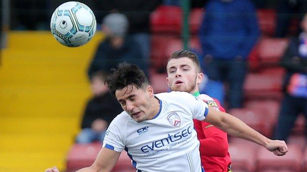 Coleraine's Aaron Traynor and Rory Donnelly of Cliftonville in aerial action