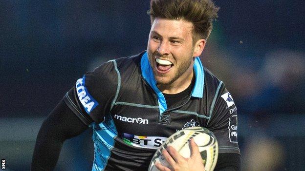 Glasgow scrum-half Ali Price runs with the ball against Zebre