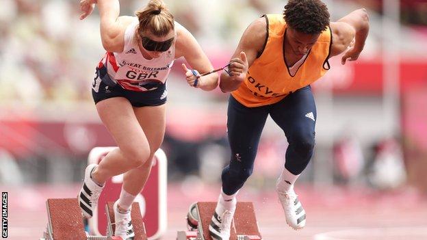 Libby Clegg and her guide running