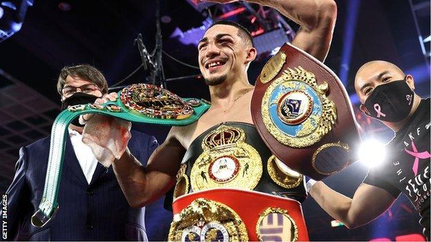 Teofimo Lopez celebrates with all his belts