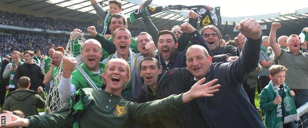 Hibs supporters celebrate victory on the Hampden pitch