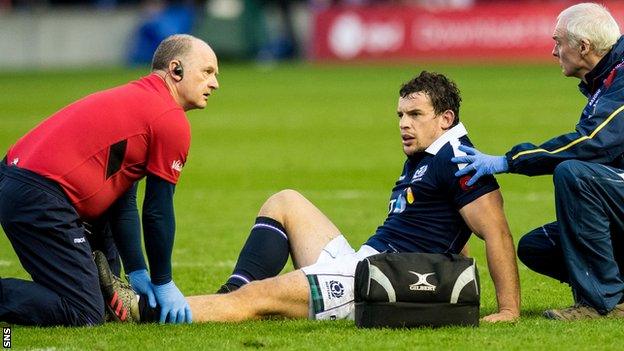 Scotland's John Hardie receives treatment