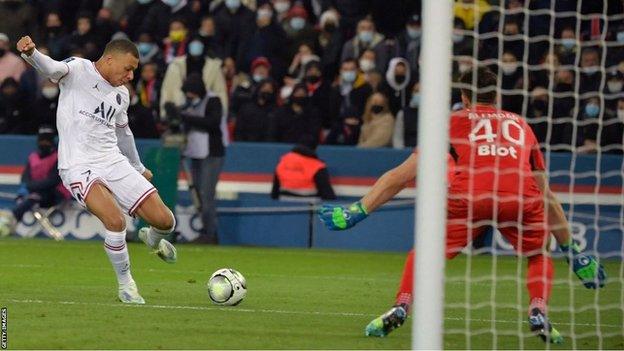 Kylian Mbappe takes a shot against Rennes