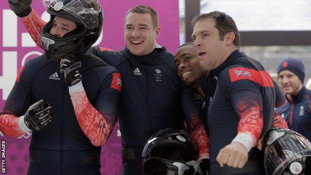 John James Jackson, Stuart Benson, Bruce Tasker and Joel Fearon of Great Britain during the Men's Four-Man Bobsleigh at the Sochi 2014 Winter Olympics