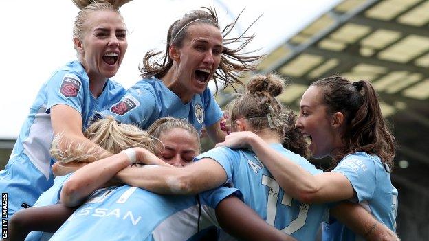 Jill Scott, centre, celebrates with Manchester City team-mates