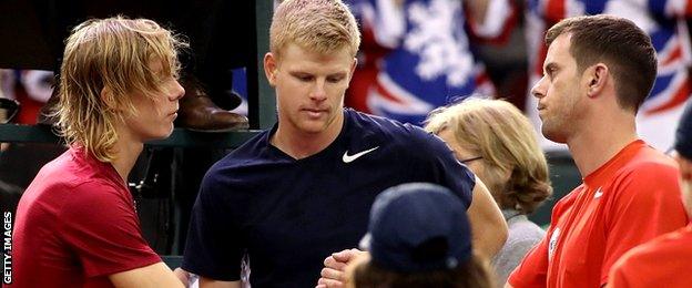 Denis Shapovalov of Canada shake hands with Great Britain coach Leon Smith and Kyle Edmund of Great Britain