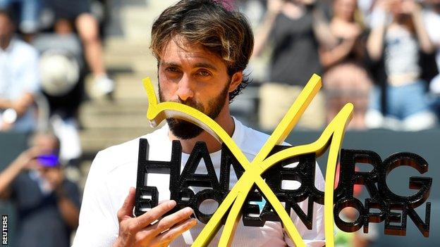 Nikoloz Basilashvili celebrates winning Hamburg Open