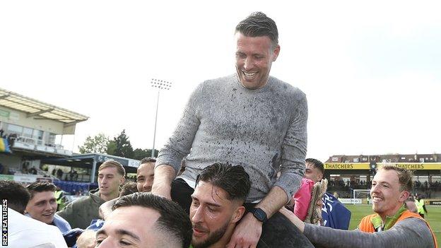 Forest Green manager Rob Edwards celebrates their promotion