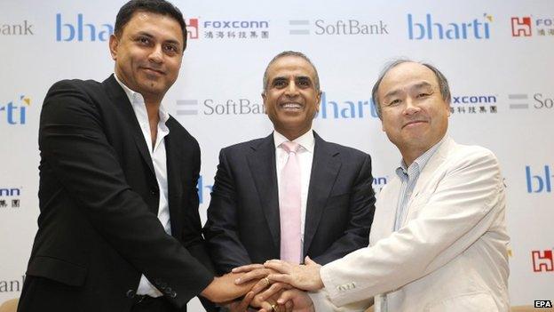 President of Softbank Nikesh Arora(L), Chairman of Bharti Enterprises Sunil Bharti Mittal (C) and Chairman and CEO Masayoshi Son (R) pose for a photograph during a Press conference in New Delhi, India, 22 June 2015