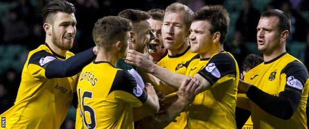 Hibernian's Anthony Stokes and Dumbarton's Mark Docherty clash