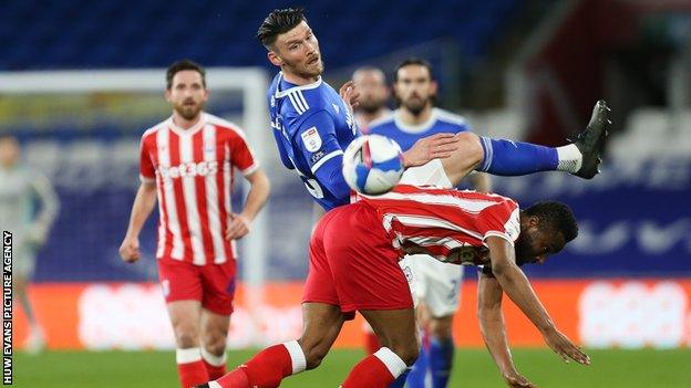 Kieffer Moore challenging for the ball
