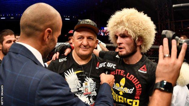 Khabib Nurmagomedov with his father and coach Abdulmanap after beating Dustin Poirier