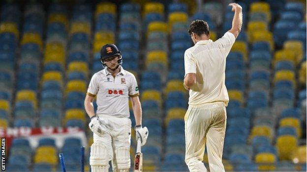 Richard Gleeson celebrates the dismissal of Callum Taylor