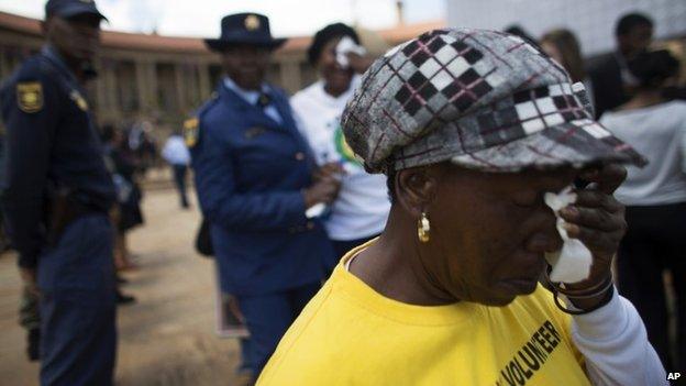 Emotional mourner at lying in state of Nelson Mandela in Pretoria on 11 December 2013