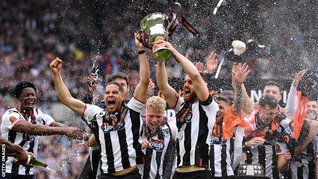 Grimsby Town celebrate with the trophy