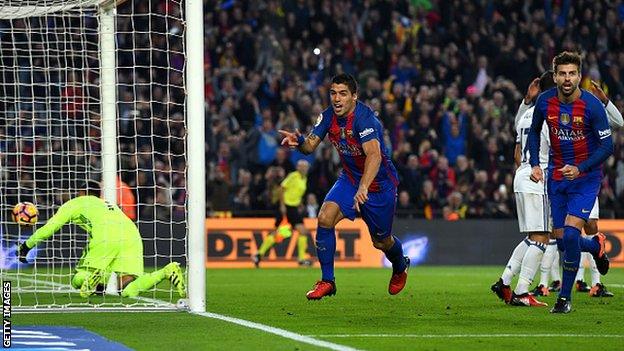 Barcelona forward Luis Suarez celebrates after scoring against Real Madrid