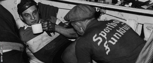 A six-day rider rests in a bunk under the track