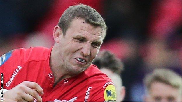 Hadleigh Parkes attempts to break a tackle