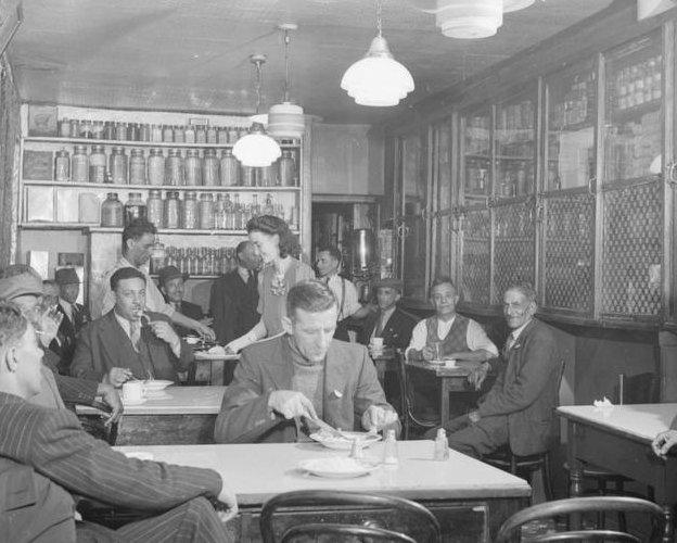 'The Cairo', a popular cafe run by Ali Salaman, (in background doorway) and his wife, Olive from the Rhondda. They met when she was a nurse and made a wrong turning coming out of the cinema