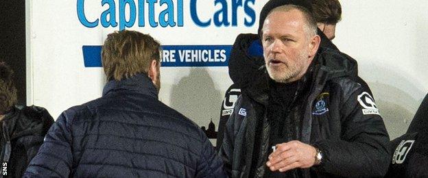 Hearts' Robbie Neilson and Caley Thistle's John Hughes shake hands