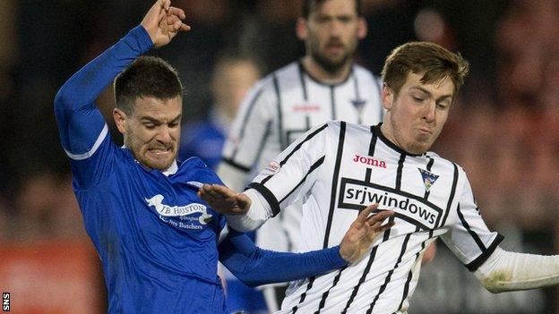 Dunfermline's Lewis Martin (right) and Queen of the South's Kyle Jacobs compete for the ball