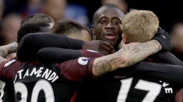 Man City celebrate Yaya Toure's goal