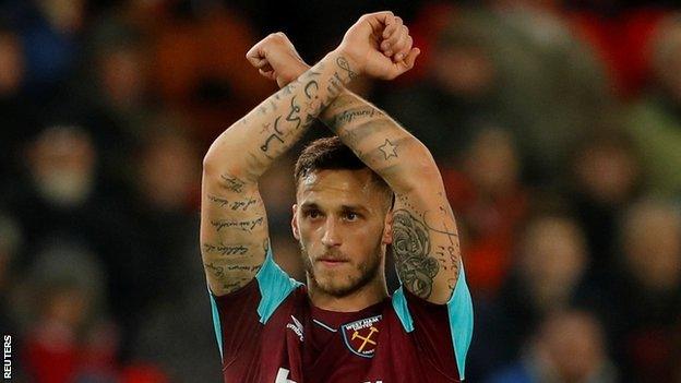 Marko Arnautovic gestures to West Ham fans as he leaves the pitch