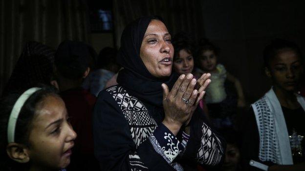 Palestinian relatives mourn during the funeral of eight-month-old Layila al-Ghandour,