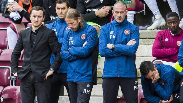 Ian Cathro watches as his side are knocked out of the League Cup