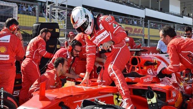 Sebastian Vettel gets out of his car before the Japanese Grand Prix