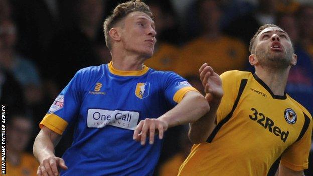 Martin Riley challenges Newport's Robbie Willmott