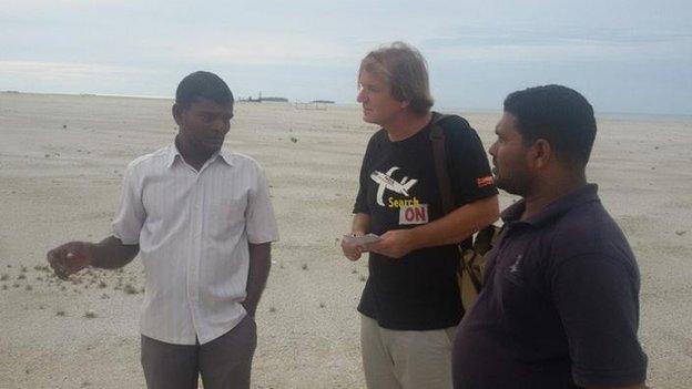 Blaine Gibson showing two pieces of possible MH370 debris found in Madagascar