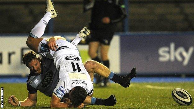 Cardiff Blues' Alex Cuthbert and Glasgow Warriors' Lee Jones collide