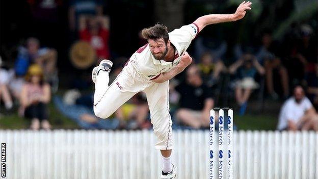 Michael Neser bowling for Queensland