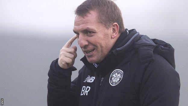 Brendan Rodgers makes a point to his players at Celtic training