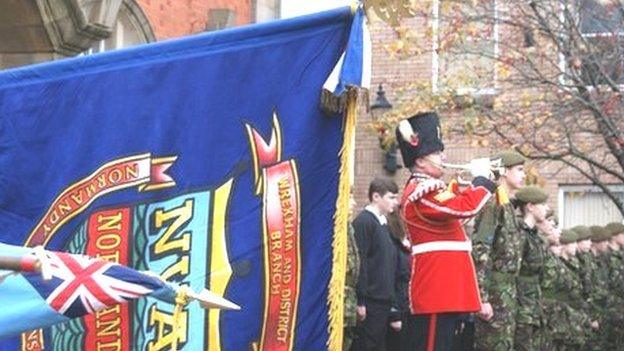 Flags and bugler in Wrexham during a remembrance service in 2013