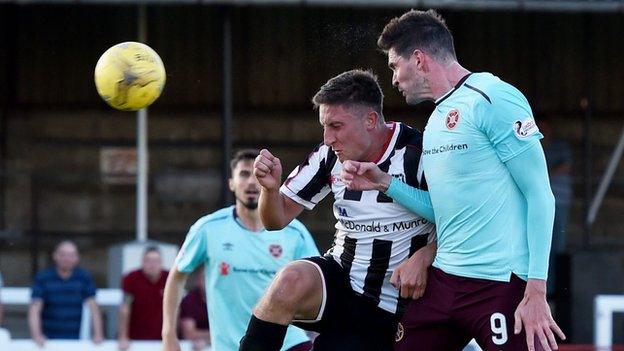 Kyle Lafferty (right) scores