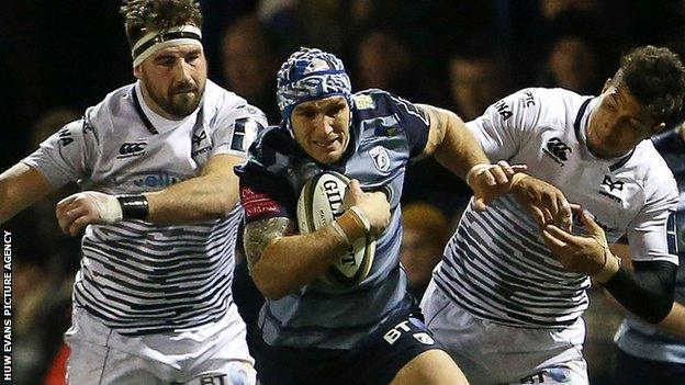 Tom James makes a break for Cardiff Blues against Ospreys