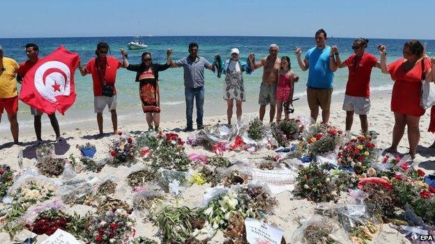 Tunisians and tourists on the beach at Sousse