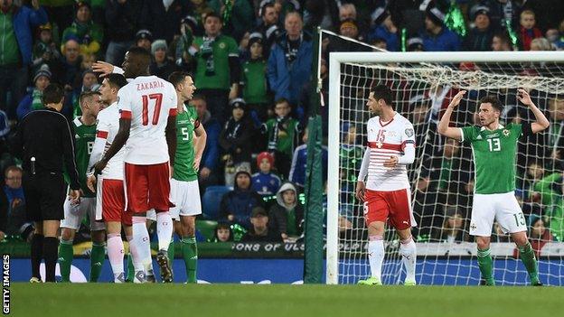 Corry Evans shows his disbelief after being adjudged to have have handled in the controversial World Cup play-off against Switzerland in 2017