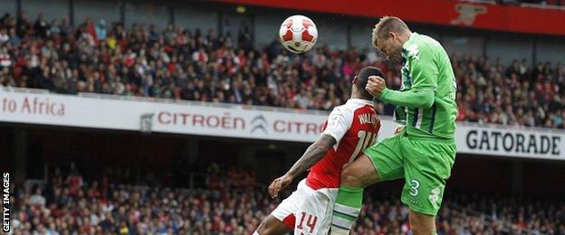 Former Arsenal striker Nicklas Bendtner in action for Wolfsburg against his old club