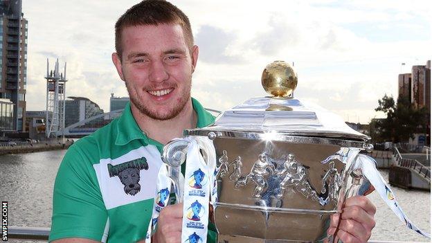 Ireland and Rochdale Hornets prop Matty Hadden gets his hands on the World Cup trophy