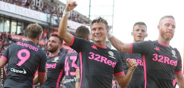 Ezgjan Alioski (centre) celebrates his goal against Stoke with his Leeds teammates