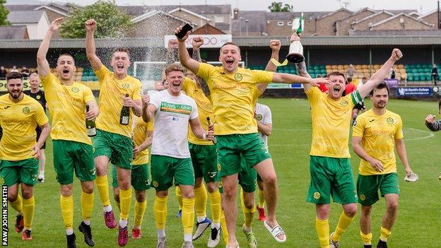 Caernarfon Town players celebrate their win in the 2022 Cymru Premier play-off final