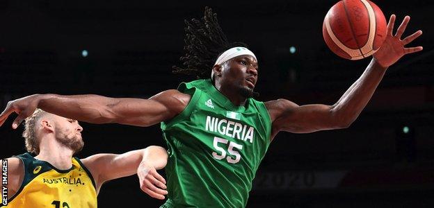 Nigeria's Precious Achiuwa (right) handles the ball in a game against Australia at the Tokyo Olympics