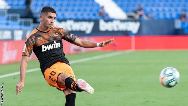 New Manchester City winger Ferran Torres delivers a cross while playing for former club Valencia