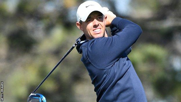 Rory McIlroy watches his tee shot on the fifth hole on the South Course on day one at Torrey Pines