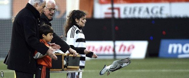 Doves are released before Lorient v PSG to honour victims of the Paris attacks