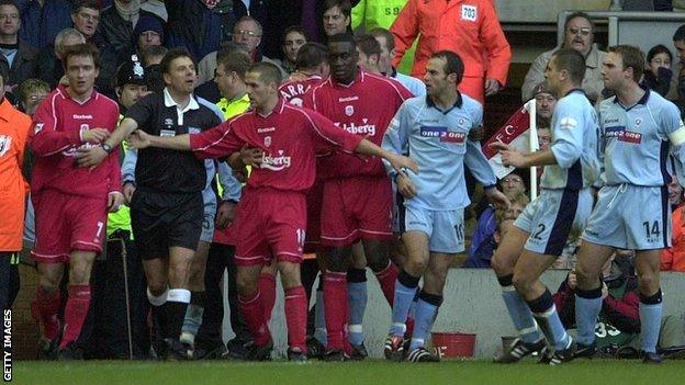 In 2001, Liverpool's Michael Owen had to keep Rotherham's Paul Warne and the Reds' Vladimir Smicer apart as they fought in their FA Cup third-round tie